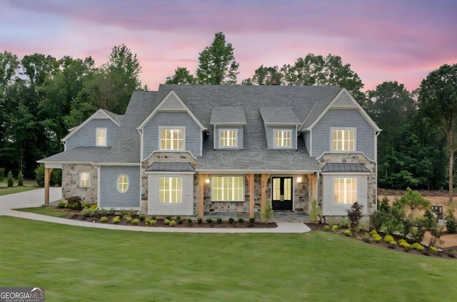 615 Claxton Ln, Milton, GA 30004 - view of front of property with a front yard, stone siding, and a standing seam roof
