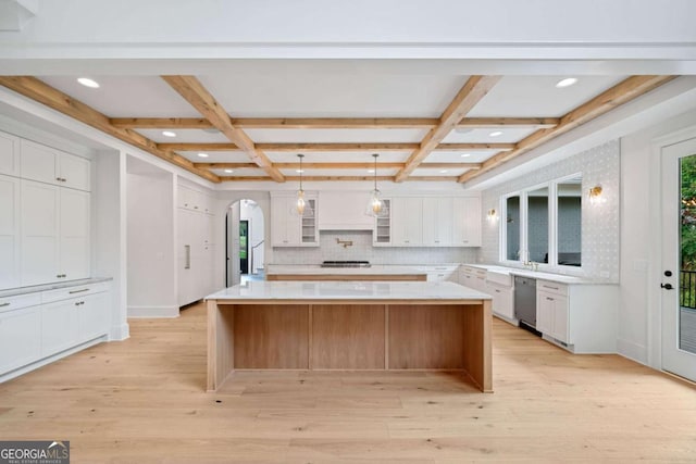 615 Claxton Ln, Milton, GA 30004 - kitchen featuring appliances with stainless steel finishes, arched walkways, white cabinets, coffered ceiling, and backsplash