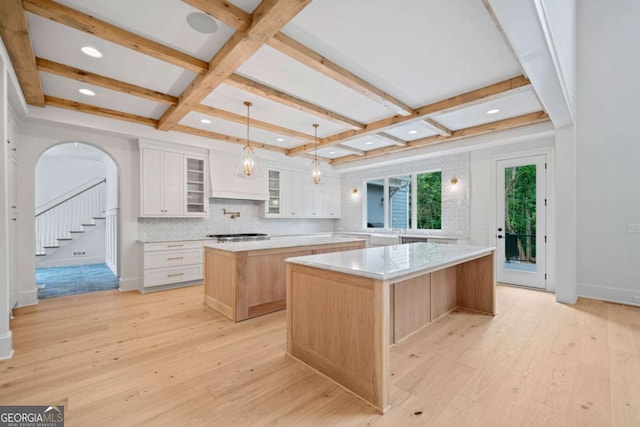 615 Claxton Ln, Milton, GA 30004 - kitchen featuring a large island, coffered ceiling, light wood-style floors, light countertops, and beamed ceiling