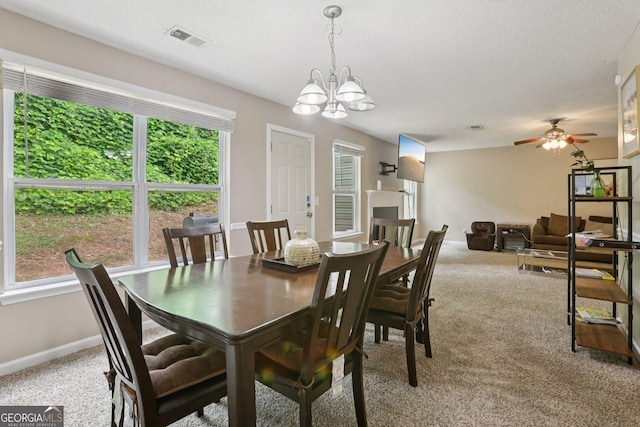 7813 Newbury Dr, Jonesboro, GA 30236 - carpeted dining space with a chandelier, ceiling fan, and baseboards