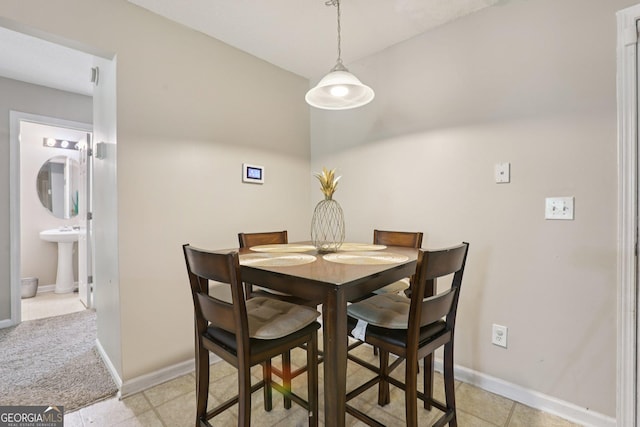 7813 Newbury Dr, Jonesboro, GA 30236 - dining area with baseboards and light tile patterned floors