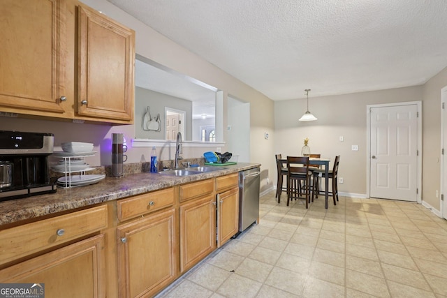 7813 Newbury Dr, Jonesboro, GA 30236 - kitchen with stainless steel dishwasher, a sink, brown cabinets, dark countertops, and a textured ceiling