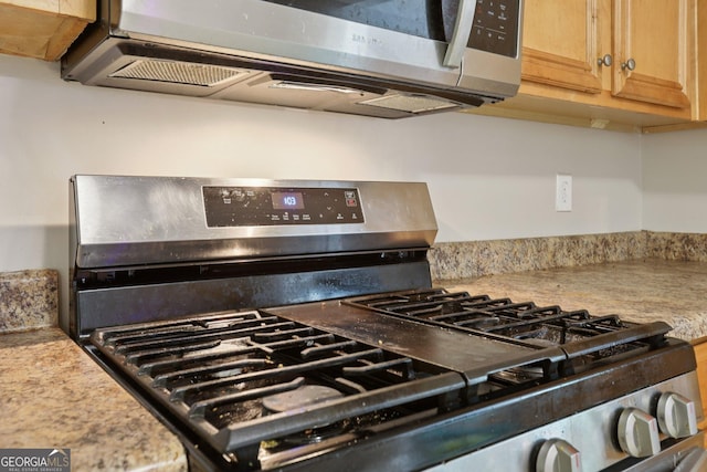 7813 Newbury Dr, Jonesboro, GA 30236 - kitchen view of appliances with stainless steel finishes and light countertops
