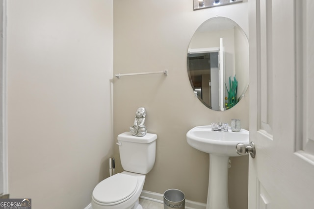 7813 Newbury Dr, Jonesboro, GA 30236 - bathroom with toilet and baseboards