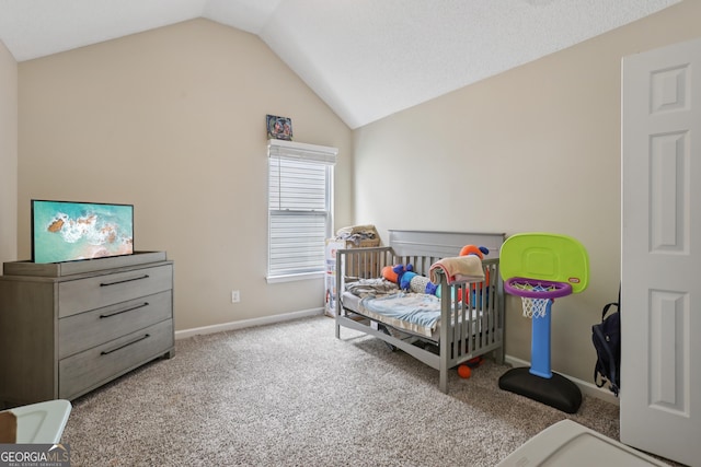 7813 Newbury Dr, Jonesboro, GA 30236 - carpeted bedroom with lofted ceiling and baseboards