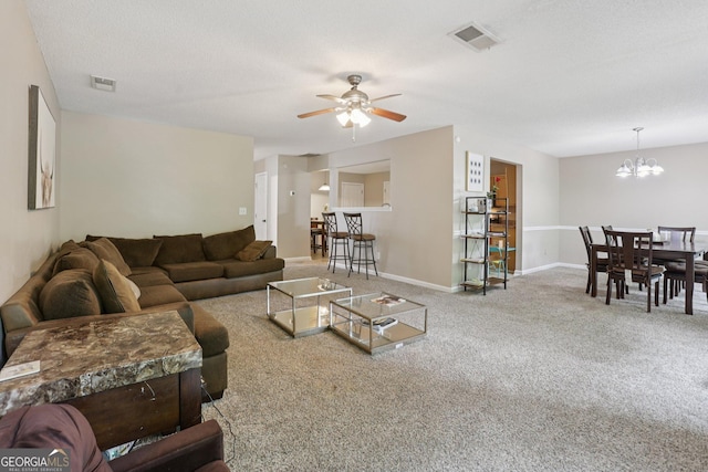 7813 Newbury Dr, Jonesboro, GA 30236 - carpeted living room featuring ceiling fan, a chandelier, and baseboards