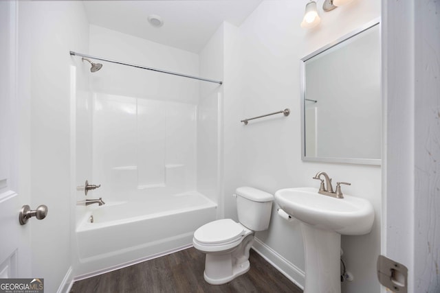 9929 Long Leaf Pine Dr, Midland, GA 31820 - bathroom featuring toilet, wood finished floors, baseboards, and bathing tub / shower combination