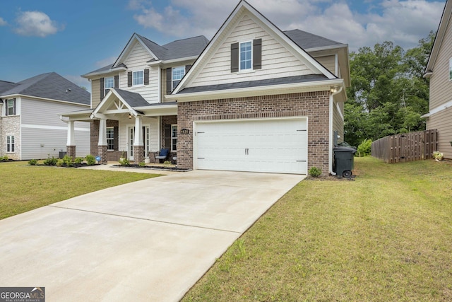 9929 Long Leaf Pine Dr, Midland, GA 31820 - view of front of property featuring brick siding, covered porch, concrete driveway, a shingled roof, and a garage
