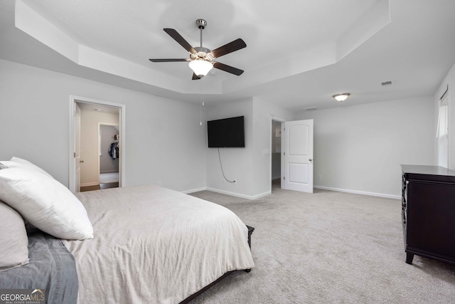 9929 Long Leaf Pine Dr, Midland, GA 31820 - carpeted bedroom featuring a tray ceiling, baseboards, and ceiling fan