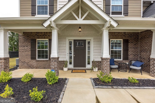 9929 Long Leaf Pine Dr, Midland, GA 31820 - doorway to property featuring covered porch and brick siding
