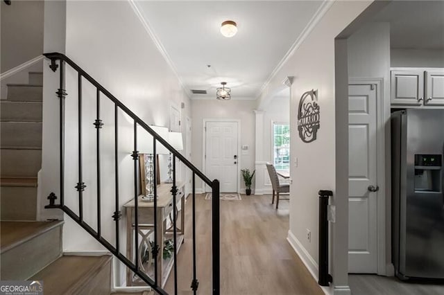 3088 Steeplechase Dr, Alpharetta, GA 30004 - stairway featuring wood finished floors, crown molding, and baseboards