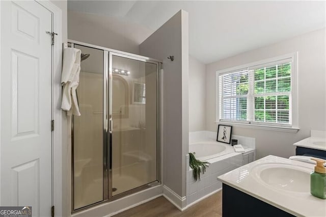 3088 Steeplechase Dr, Alpharetta, GA 30004 - bathroom featuring a shower stall, a garden tub, vanity, and wood finished floors