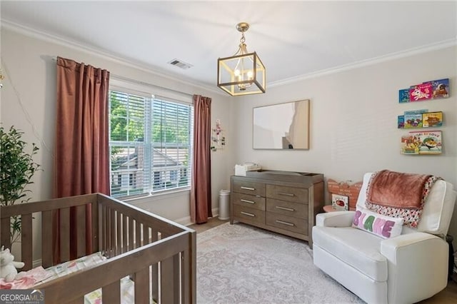 3088 Steeplechase Dr, Alpharetta, GA 30004 - bedroom with a chandelier, ornamental molding, a crib, baseboards, and light colored carpet