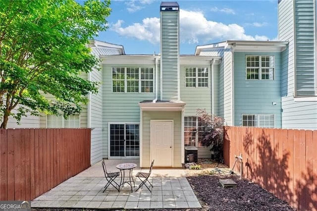 3088 Steeplechase Dr, Alpharetta, GA 30004 - rear view of house with a patio area and a chimney
