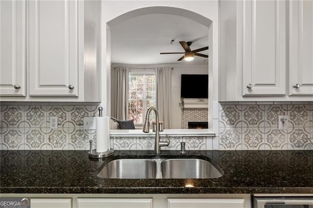 3088 Steeplechase Dr, Alpharetta, GA 30004 - kitchen featuring a sink, ceiling fan, arched walkways, backsplash, and stainless steel dishwasher