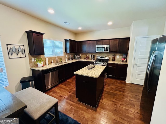 5848 Rex Ridge Loop, Rex, GA 30273 - kitchen with stainless steel appliances, a sink, a kitchen island, decorative backsplash, and recessed lighting