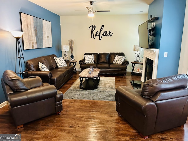 5848 Rex Ridge Loop, Rex, GA 30273 - living room featuring a ceiling fan, wood finished floors, a fireplace with flush hearth, and baseboards