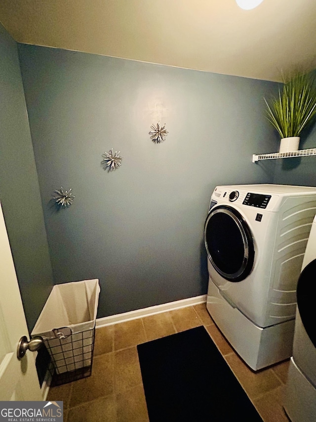 5848 Rex Ridge Loop, Rex, GA 30273 - laundry room with washer / clothes dryer and baseboards