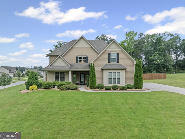 108 Donovan Ave, Locust Grove, GA 30248 - traditional-style home with a front yard, a shingled roof, and covered porch