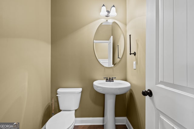 108 Donovan Ave, Locust Grove, GA 30248 - bathroom featuring toilet and baseboards