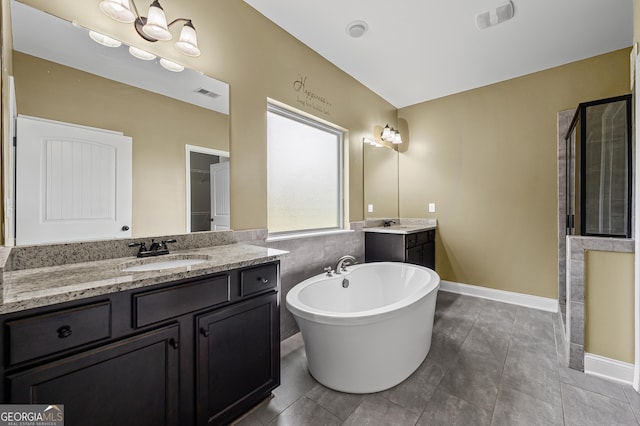 108 Donovan Ave, Locust Grove, GA 30248 - full bathroom featuring a freestanding bath, two vanities, tiled shower, and baseboards