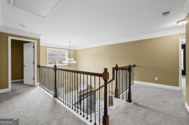 108 Donovan Ave, Locust Grove, GA 30248 - hall with attic access, crown molding, carpet, baseboards, and a chandelier