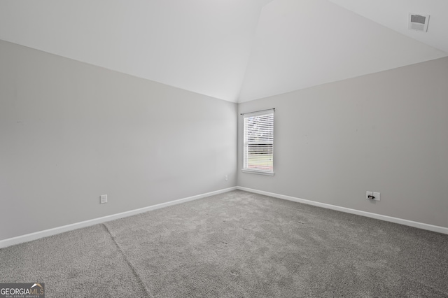 108 Donovan Ave, Locust Grove, GA 30248 - spare room featuring baseboards, carpet flooring, and high vaulted ceiling