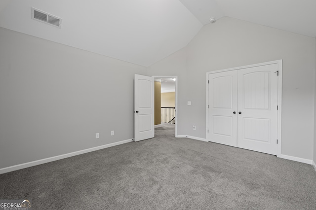 108 Donovan Ave, Locust Grove, GA 30248 - unfurnished bedroom featuring carpet, baseboards, a closet, and high vaulted ceiling