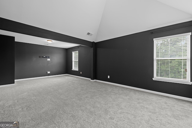 108 Donovan Ave, Locust Grove, GA 30248 - carpeted empty room with high vaulted ceiling and baseboards