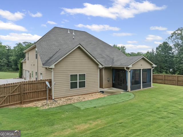 108 Donovan Ave, Locust Grove, GA 30248 - rear view of property with a sunroom, roof with shingles, and an attached garage