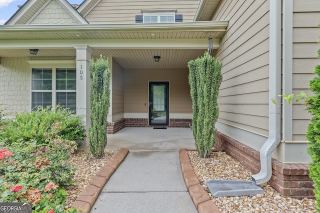 108 Donovan Ave, Locust Grove, GA 30248 - doorway to property featuring covered porch
