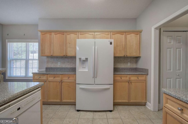 2500 Rosehill Cir, Lithia Springs, GA 30122 - kitchen with white appliances, tasteful backsplash, and light tile patterned floors
