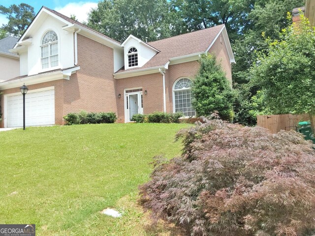 3332 Glenrose Trl, Chamblee, GA 30341 - view of front facade featuring a garage, brick siding, and a shingled roof