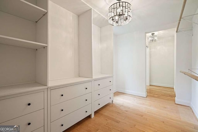 326 Seldom Seen Trl, Canton, GA 30115 - spacious closet featuring a chandelier and light wood-type flooring