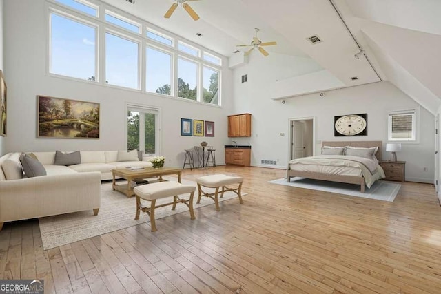 326 Seldom Seen Trl, Canton, GA 30115 - bedroom with high vaulted ceiling and light wood-style floors