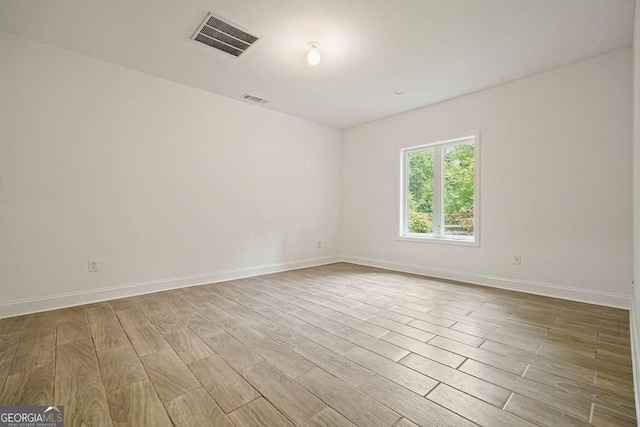 326 Seldom Seen Trl, Canton, GA 30115 - unfurnished room featuring wood finished floors