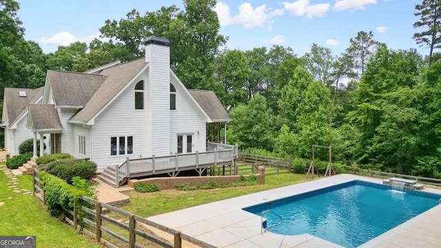 326 Seldom Seen Trl, Canton, GA 30115 - view of pool with a wooden deck, a fenced backyard, and view of scattered trees