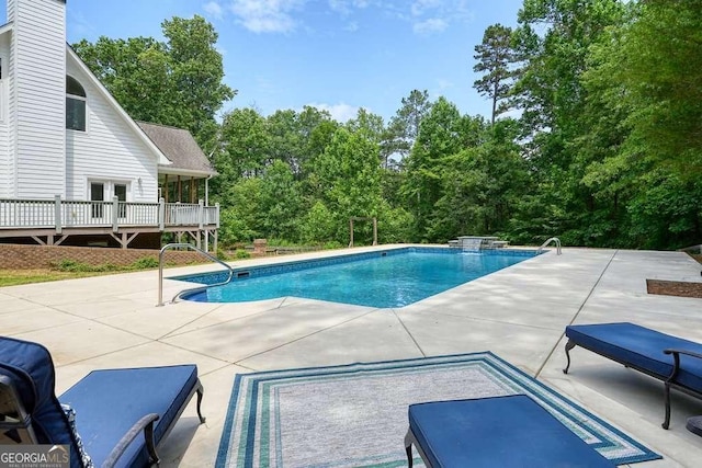 326 Seldom Seen Trl, Canton, GA 30115 - outdoor pool with a patio and view of wooded area