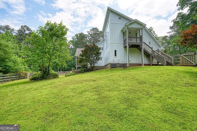 326 Seldom Seen Trl, Canton, GA 30115 - rear view of house with stairway and board and batten siding