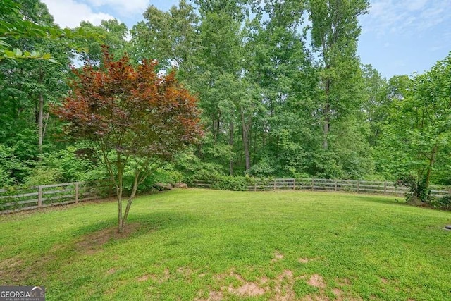 326 Seldom Seen Trl, Canton, GA 30115 - fenced backyard featuring a forest view
