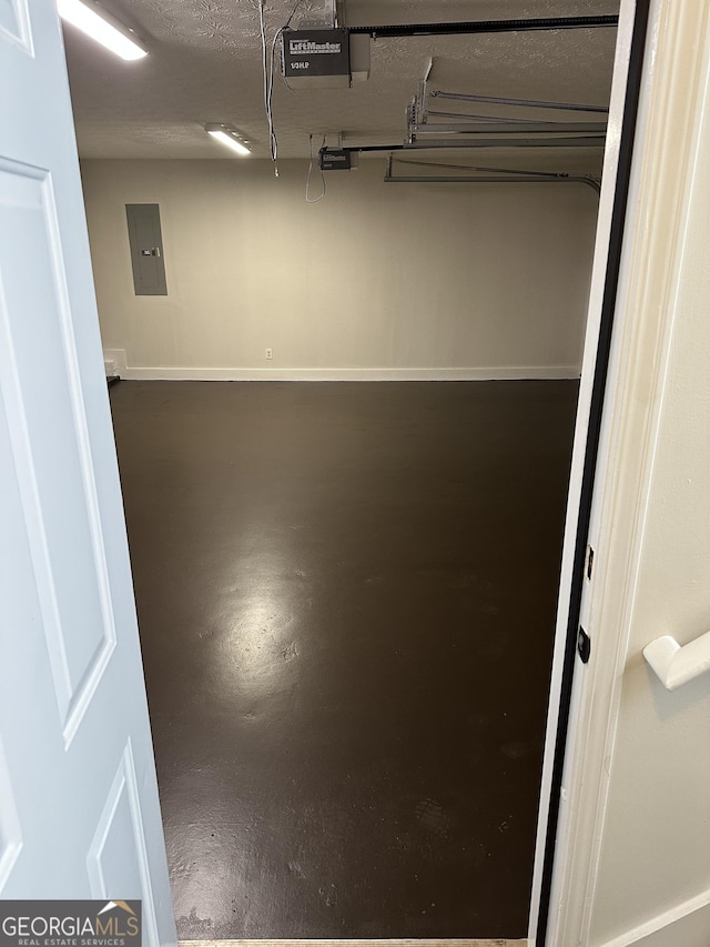140 Clover Valley Dr, Covington, GA 30016 - garage featuring electric panel and a garage door opener