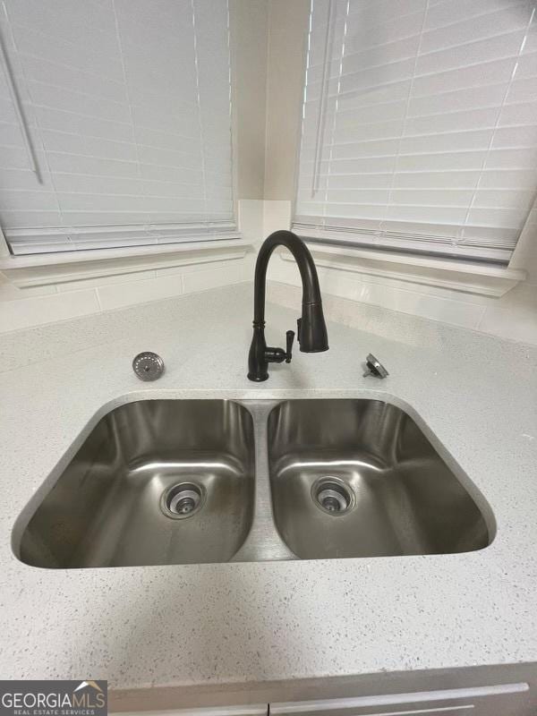 140 Clover Valley Dr, Covington, GA 30016 - kitchen view of a sink and light countertops