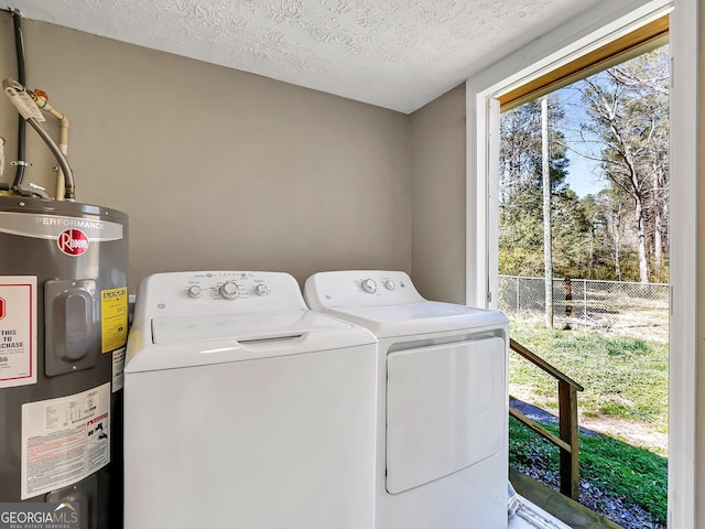 927 Dean Patrick Rd, Locust Grove, GA 30248 - laundry room with water heater, washer and clothes dryer, and a textured ceiling