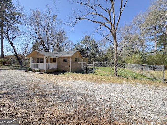 927 Dean Patrick Rd, Locust Grove, GA 30248 - view of side of property with a gate and a porch