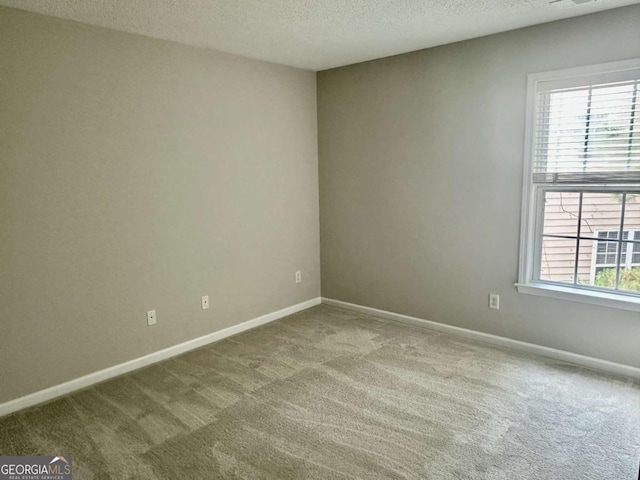 230 Wytheford Ct, Alpharetta, GA 30004 - spare room featuring carpet, a textured ceiling, and baseboards