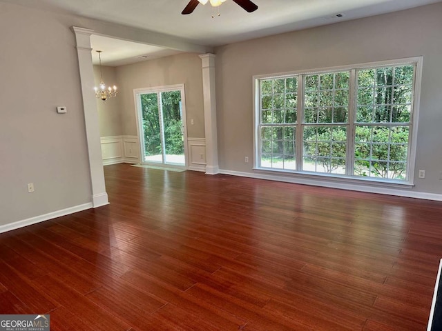 230 Wytheford Ct, Alpharetta, GA 30004 - empty room featuring ceiling fan, plenty of natural light, wood finished floors, a chandelier, and wainscoting