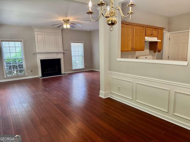 230 Wytheford Ct, Alpharetta, GA 30004 - unfurnished living room with ceiling fan, a chandelier, dark wood-style flooring, and a large fireplace