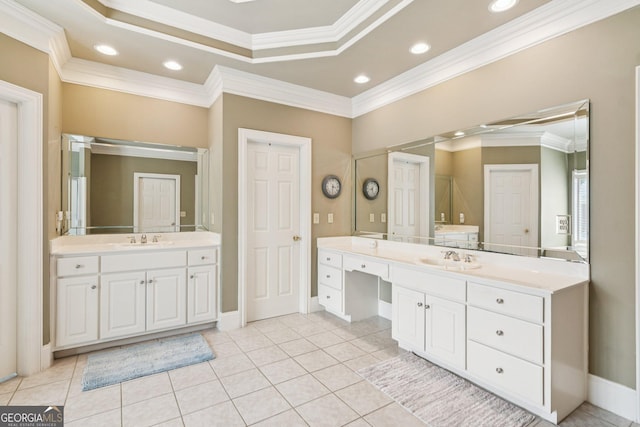 952 Moores Walk Ln, Suwanee, GA 30024 - full bath featuring crown molding, two vanities, a tray ceiling, tile patterned flooring, and baseboards