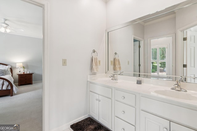 952 Moores Walk Ln, Suwanee, GA 30024 - ensuite bathroom with crown molding, double vanity, a ceiling fan, and baseboards