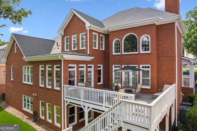 952 Moores Walk Ln, Suwanee, GA 30024 - rear view of house featuring brick siding, a chimney, a deck, and central air condition unit
